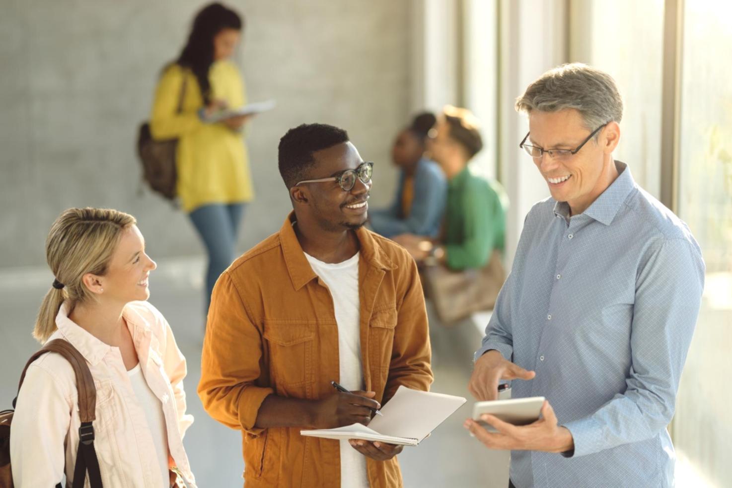 Instructor working one-on-one with student on valuation analysis